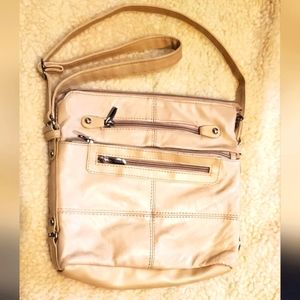 Cream leather bag many pockets on outside in great shape
